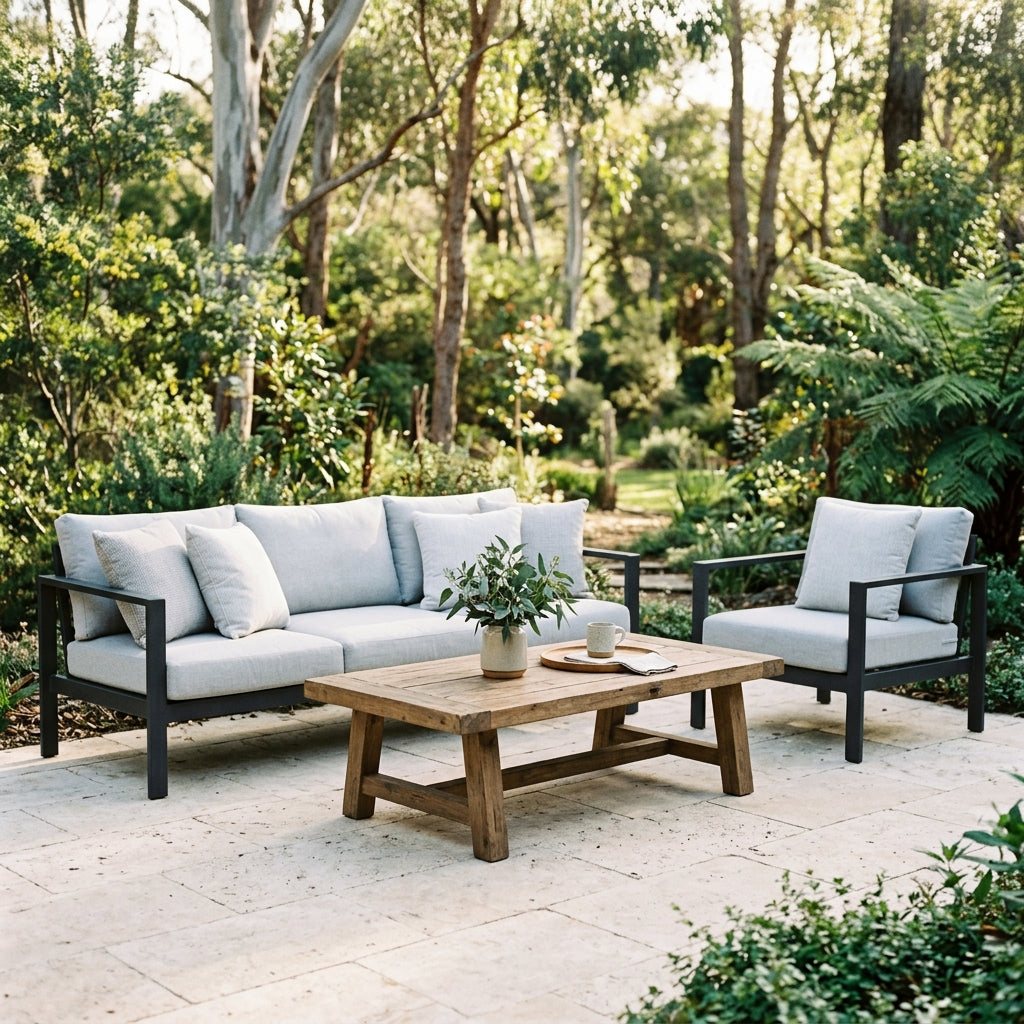 Outdoor lounge setting with sofa, armchair and timber coffee table