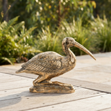 Kneeling Crane Sculpture - Gold — outdoor setting