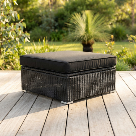 Amani Small Storage Black Char Ottoman — outdoor setting