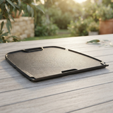 Travel Q Range Cast Iron Reversible Griddle Plate — outdoor setting